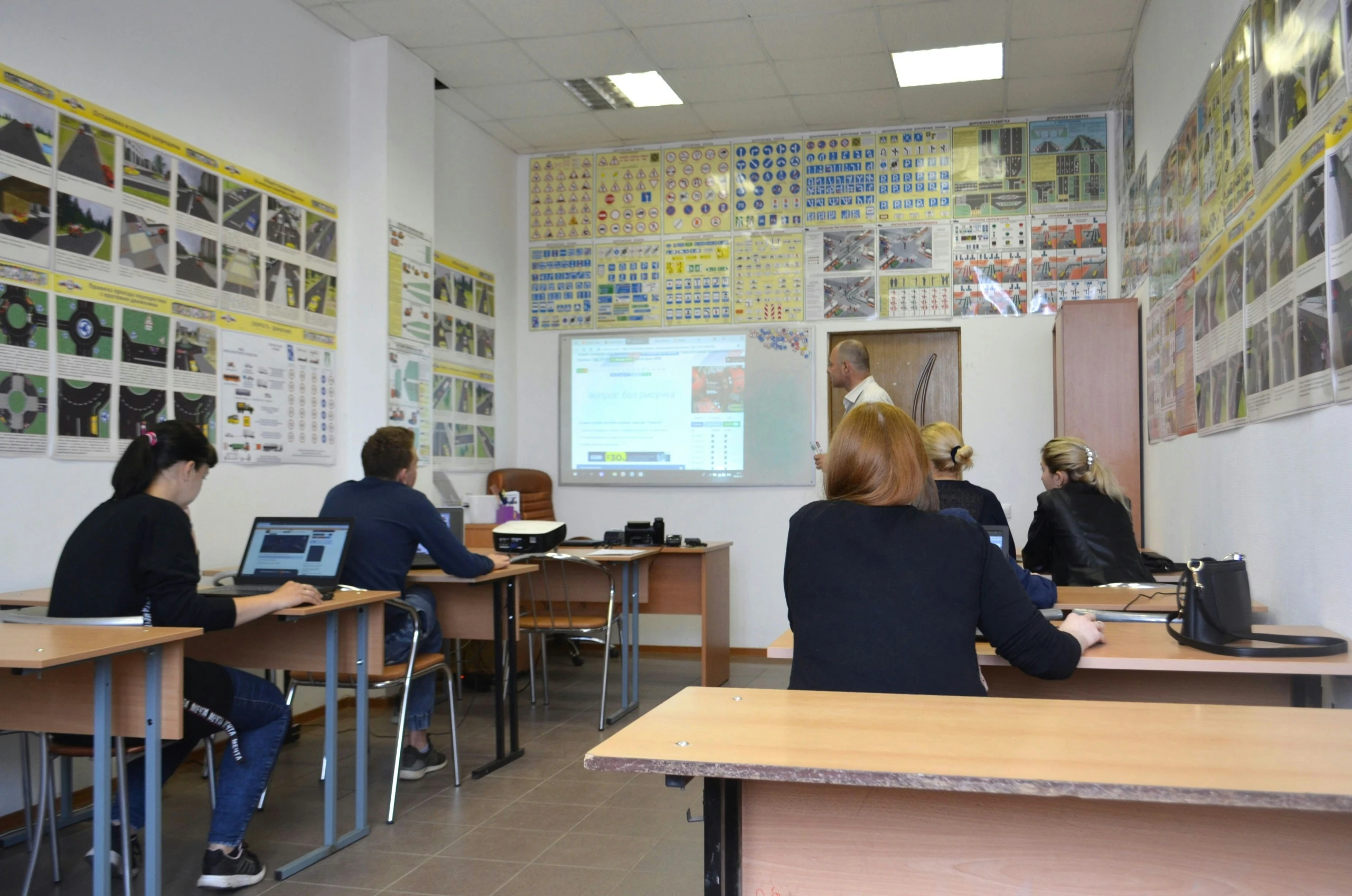 A few students at school in a technical lesson