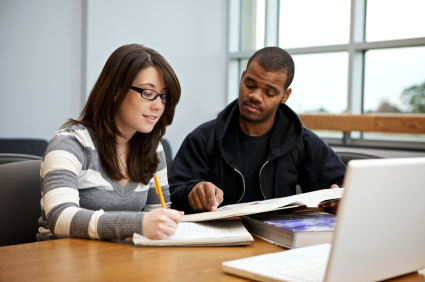 Tutor Pointing to Book to Help Student