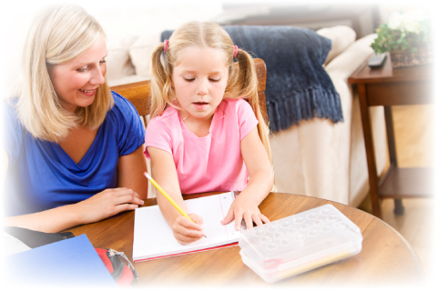 Very Young Student Writes while Her Tutor Looks on