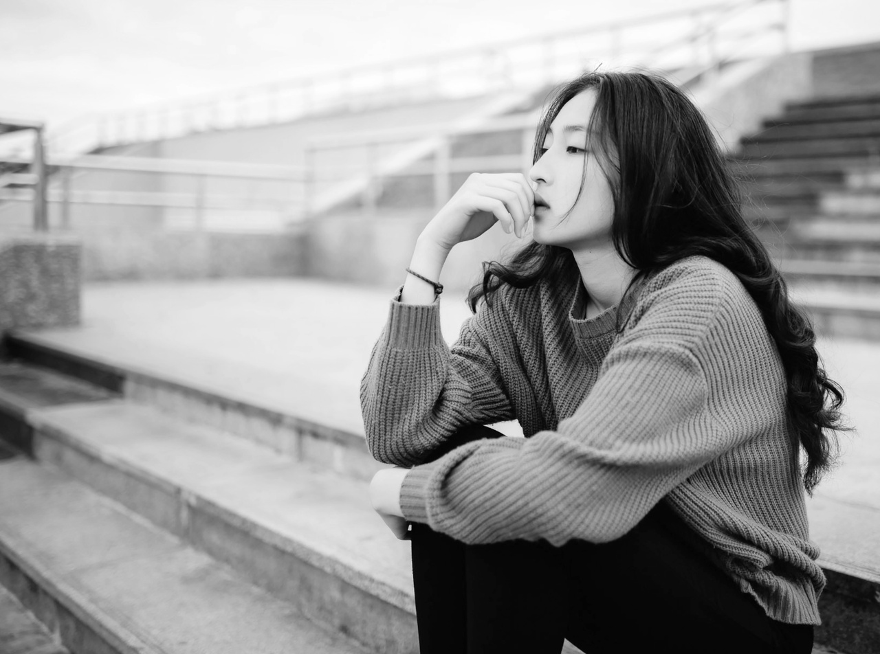 Woman Sitting and Thinking